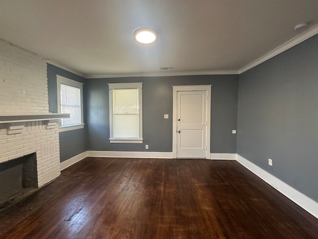 unfurnished living room featuring a fireplace, dark hardwood / wood-style flooring, and ornamental molding