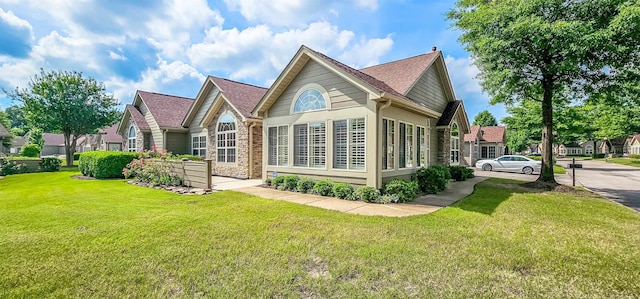 rear view of property with a lawn