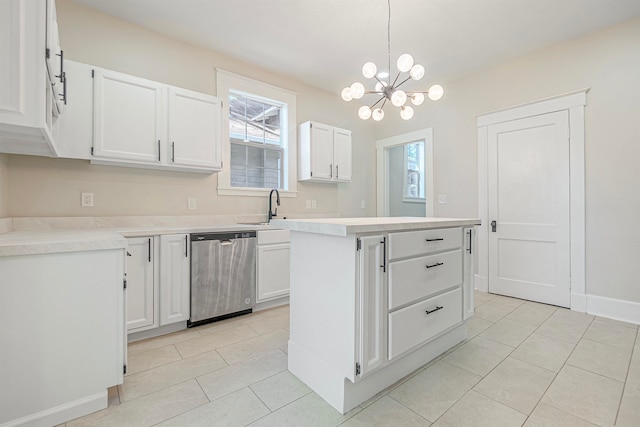 kitchen featuring dishwasher, white cabinets, an inviting chandelier, and a healthy amount of sunlight