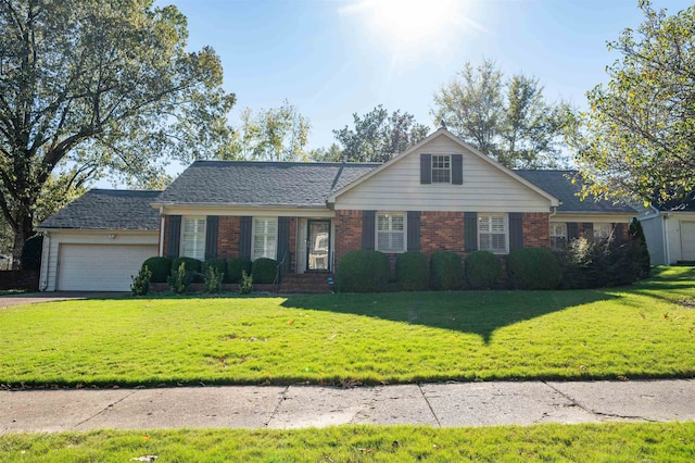 ranch-style home featuring a front lawn and a garage