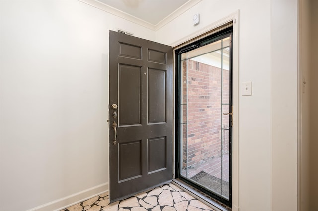 entryway featuring ornamental molding