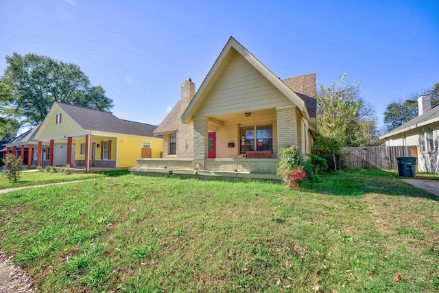 view of front of house featuring a porch and a front lawn