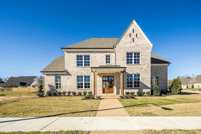 view of front facade featuring french doors and a front lawn