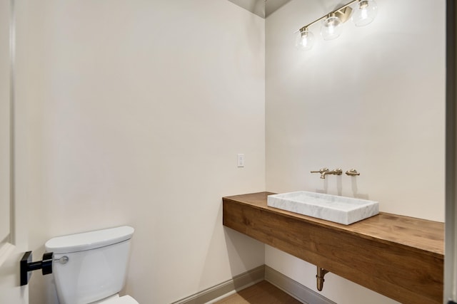 bathroom with toilet and sink