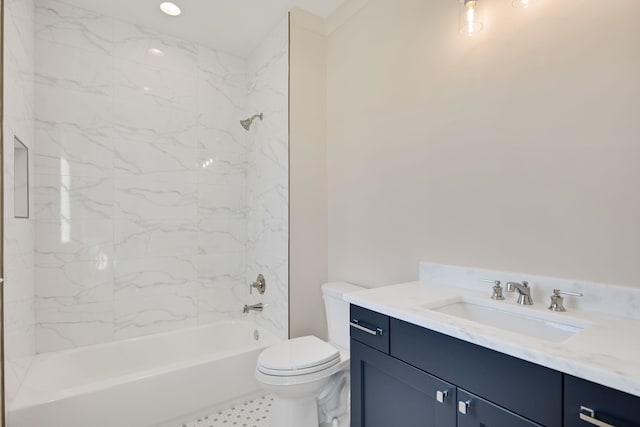 full bathroom with vanity, toilet, and tiled shower / bath