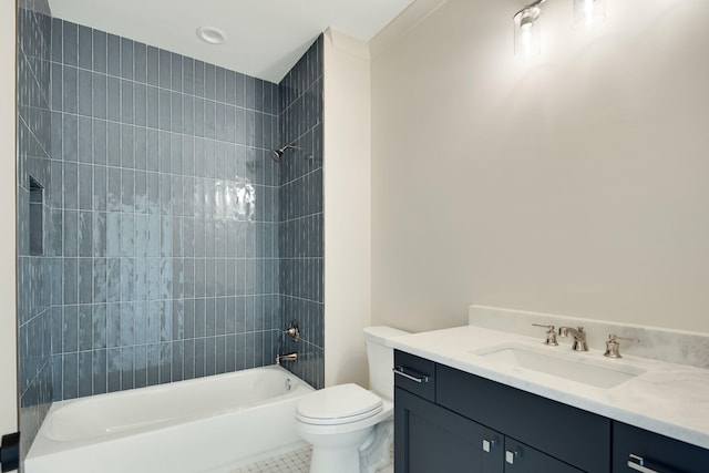 full bathroom with tile patterned flooring, vanity, tiled shower / bath combo, and toilet