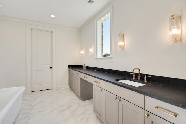 bathroom with vanity and a bathtub