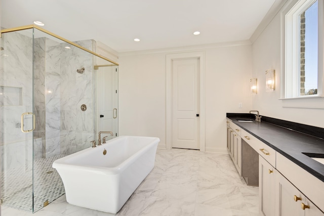 bathroom featuring separate shower and tub and vanity