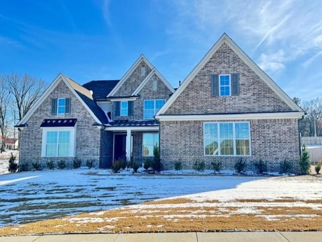 view of front of property featuring brick siding