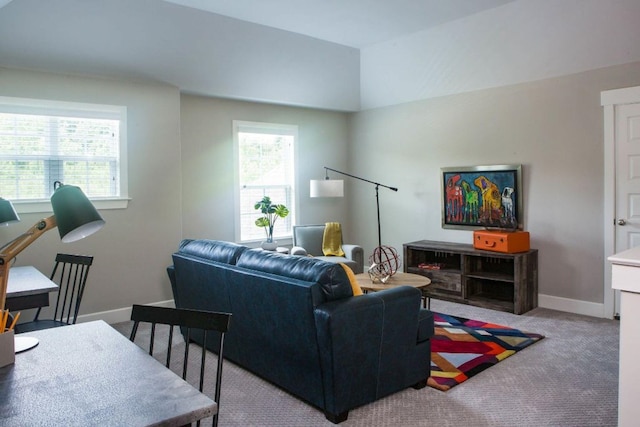 living room with light carpet and baseboards