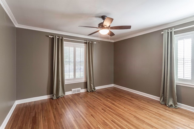 unfurnished room with ceiling fan, ornamental molding, and light hardwood / wood-style flooring