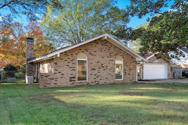 view of front of property with a front lawn and a garage