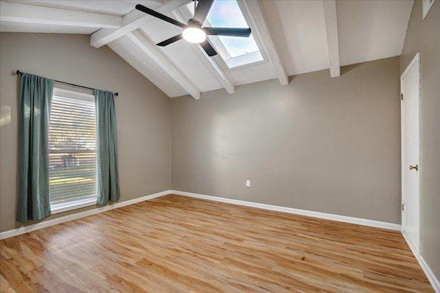 unfurnished room featuring vaulted ceiling with beams, ceiling fan, and light wood-type flooring