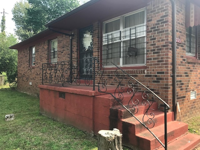 view of property exterior with a lawn