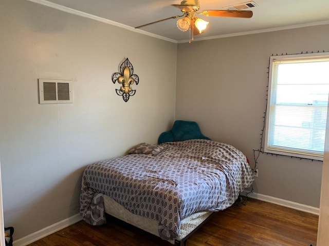 bedroom featuring dark hardwood / wood-style floors, ceiling fan, and ornamental molding