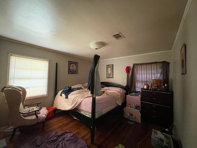 bedroom featuring dark hardwood / wood-style flooring and ornamental molding