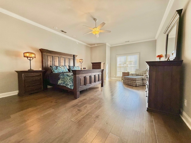 bedroom featuring hardwood / wood-style floors, ceiling fan, and crown molding