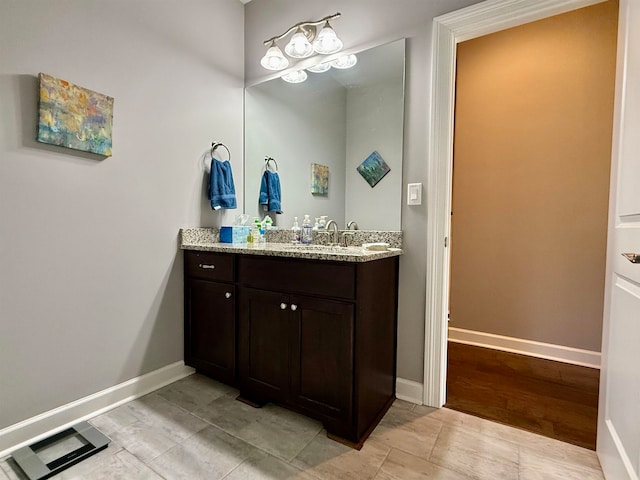 bathroom featuring hardwood / wood-style floors and vanity