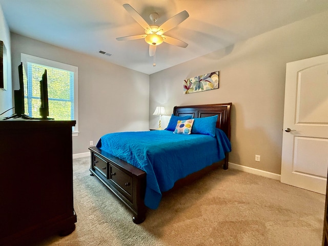 bedroom with light carpet and ceiling fan