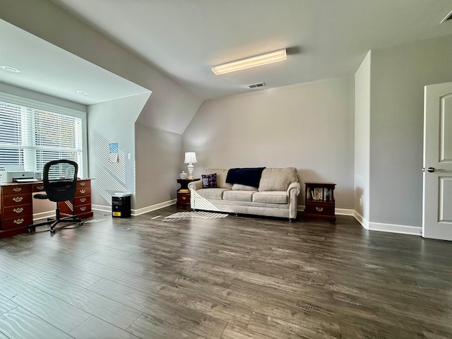 living room featuring vaulted ceiling and dark wood-type flooring