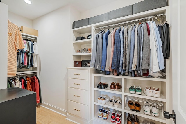 spacious closet featuring light hardwood / wood-style floors