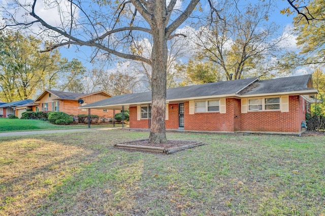 ranch-style house with a front lawn and a carport