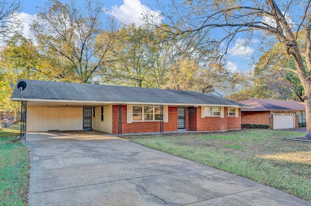 ranch-style home featuring a front yard and a carport