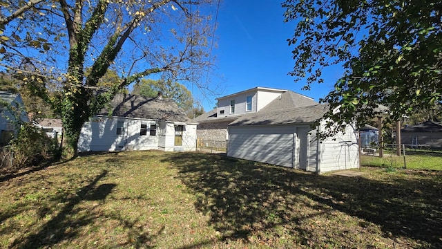 rear view of property with a lawn