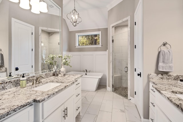 bathroom featuring a notable chandelier, separate shower and tub, crown molding, and vanity