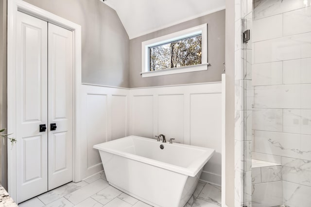 bathroom with shower with separate bathtub and lofted ceiling