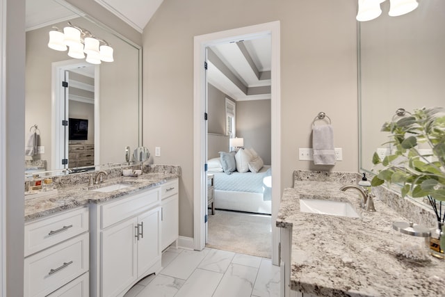 bathroom featuring vanity, lofted ceiling, and ornamental molding