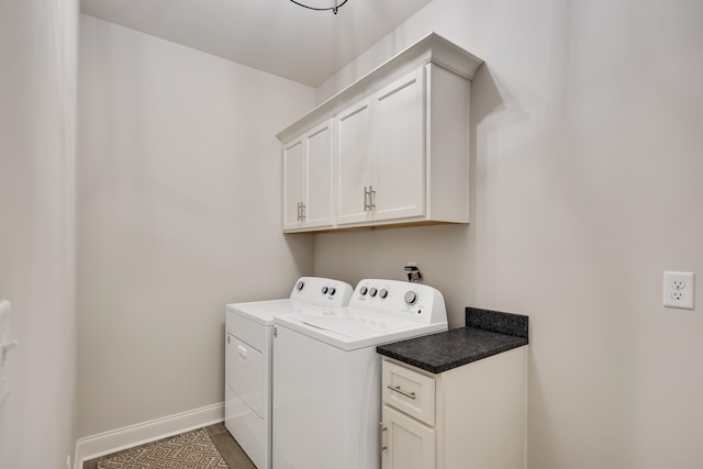 laundry area featuring cabinets and washer and dryer