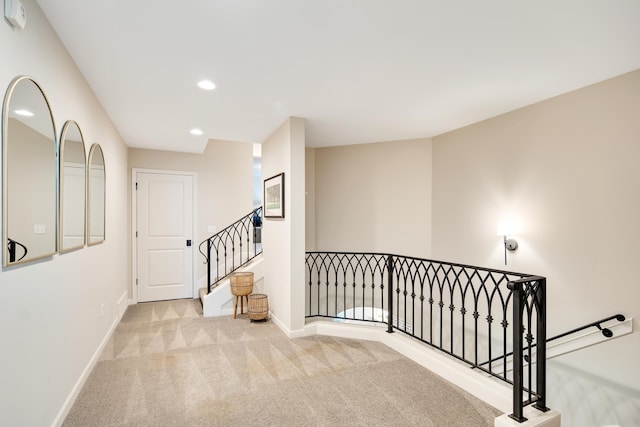 hallway with light carpet