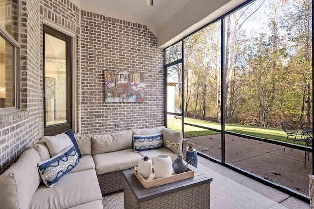 sunroom / solarium featuring vaulted ceiling