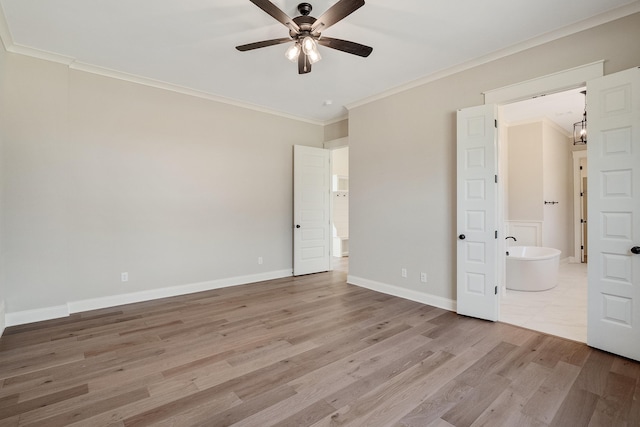 unfurnished bedroom with light hardwood / wood-style floors, ensuite bath, ceiling fan, and crown molding