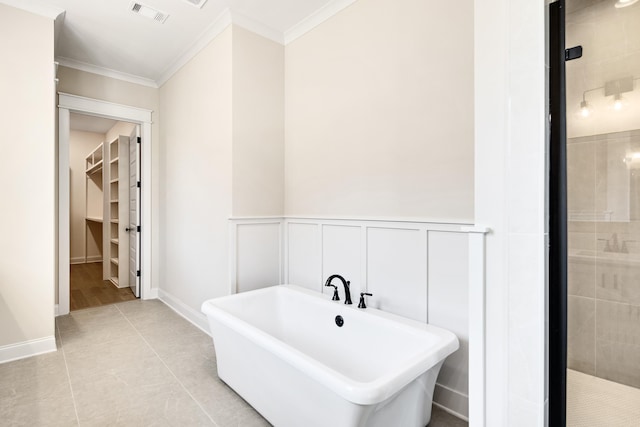 520 Valley Forge Ln, Rossville, TN 38066 - full bath with ornamental molding, a freestanding tub, a stall shower, a spacious closet, and wainscoting