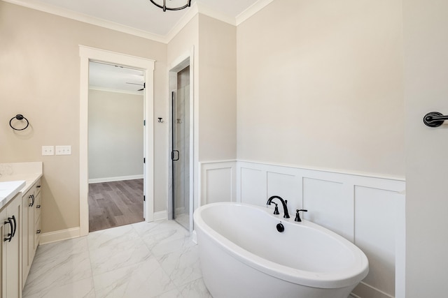 bathroom with vanity, independent shower and bath, and ornamental molding