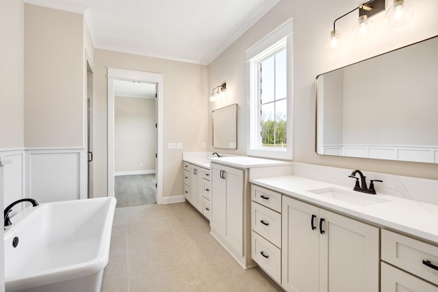 520 Valley Forge Ln, Rossville, TN 38066 - full bath with two vanities, a freestanding tub, and crown molding