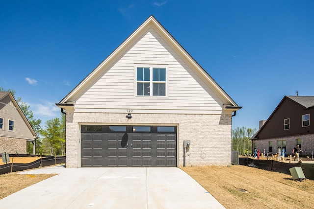 520 Valley Forge Ln, Rossville, TN 38066 - view of property exterior featuring central AC, driveway, and brick siding