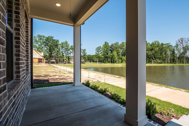 view of patio with a water view