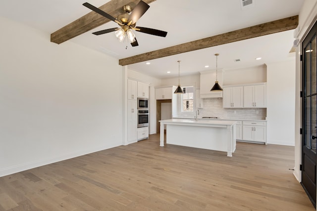 520 Valley Forge Ln, Rossville, TN 38066 - kitchen featuring stainless steel appliances, decorative backsplash, beam ceiling, light wood-style floors, and white cabinetry