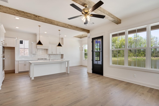 520 Valley Forge Ln, Rossville, TN 38066 - kitchen with light countertops, plenty of natural light, beam ceiling, backsplash, and baseboards