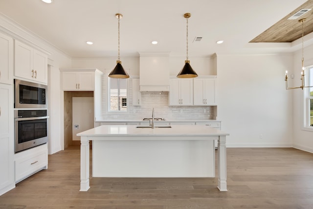 520 Valley Forge Ln, Rossville, TN 38066 - kitchen with appliances with stainless steel finishes, custom range hood, light countertops, backsplash, and ornamental molding
