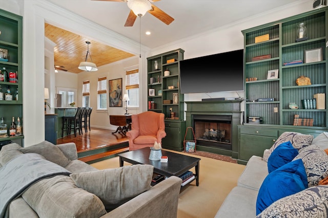 living room featuring crown molding, ceiling fan, wood ceiling, and light wood-type flooring