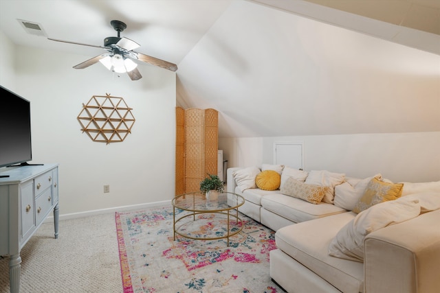 carpeted living room with ceiling fan and lofted ceiling