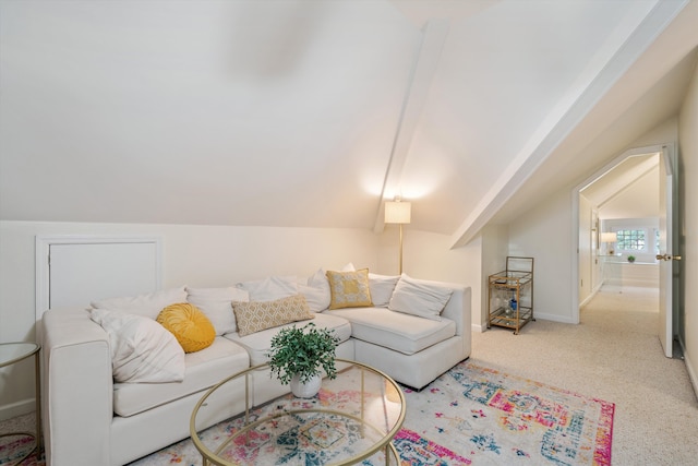 carpeted living room featuring lofted ceiling