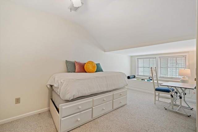 bedroom featuring light colored carpet, ceiling fan, and lofted ceiling