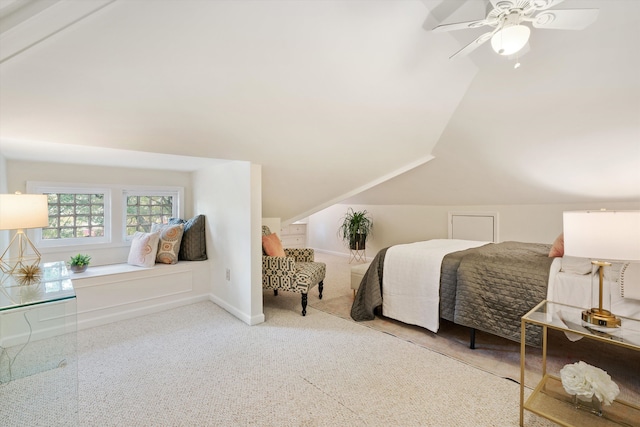 carpeted bedroom featuring ceiling fan and lofted ceiling