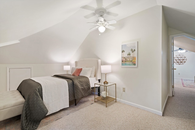 carpeted bedroom with ceiling fan and lofted ceiling