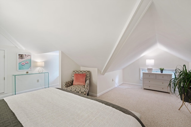 carpeted bedroom with lofted ceiling